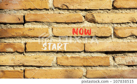 Start now symbol. Concept words Start now on beautiful brown bricks. Beautiful brick wall background. Beautiful brick wall. Business marketing, motivational start now concept. Copy space. 107838515