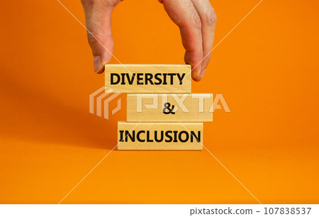 D and I, Diversity and inclusion symbol. Concept words D and I, diversity and inclusion on blocks on beautiful orange table orange background. Business, D and I, diversity and inclusion concept. 107838537