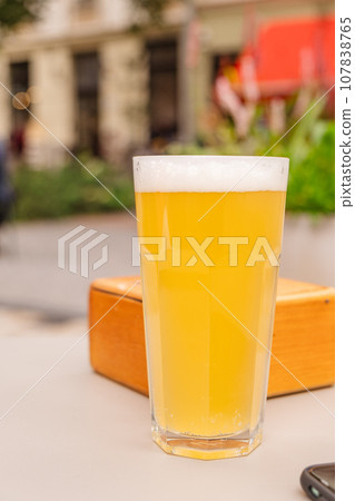 a glass of beer close up a glass of beer close up 107838765