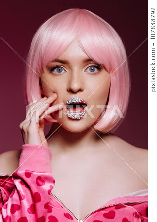Glamor portrait of surprised shocked model with pink hair Glamor portrait of surprised shocked model with pink hair 107838792