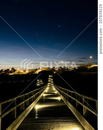 Carvoeiro boardwalk over the Algarve cliffs in Portugal. Carvoeiro boardwalk over the Algarve cliffs in Portugal. 107839229