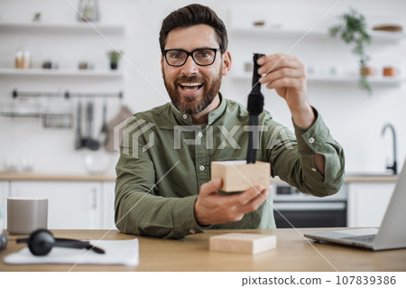 Male influencer recording video blog about new smart watch 107839386