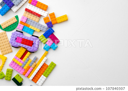 Details of kids plastic constructor on white background Details of kids plastic constructor on white background 107840307