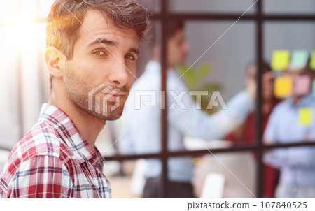 Portrait of business man posing looking at camera Portrait of business man posing looking at camera 107840525