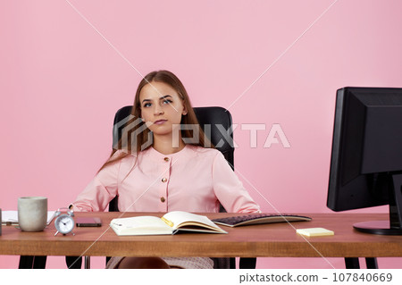 female manager using PC computer for online work at office female manager using PC computer for online work at office 107840669