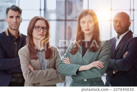 Business people stand with each other in the conference room 107840830
