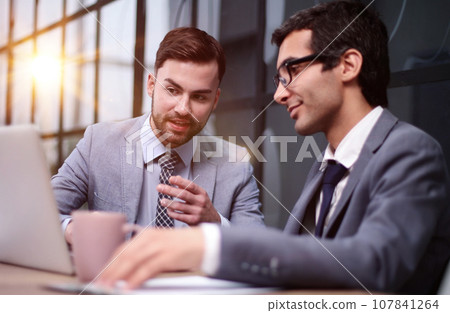 Business people discussing over new business project in office. 107841264