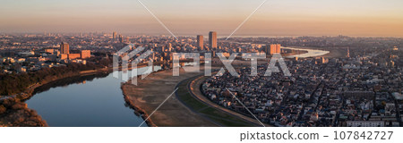 "Chiba Prefecture" A drone view of the cityscape dyed orange at dusk from near Edogawa Yagiri 107842727