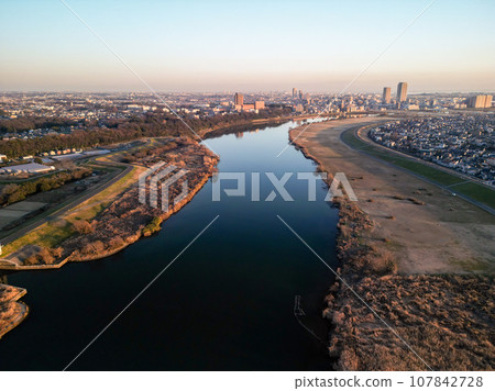"Chiba Prefecture" A drone view of the cityscape dyed orange at dusk from near Edogawa Yagiri 107842728
