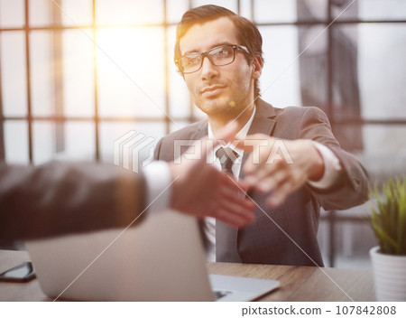 handshake of business partners at a meeting in the office 107842808