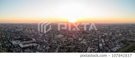 "Chiba Prefecture" A drone view of the cityscape dyed orange at dusk from near Edogawa Yagiri 107842837