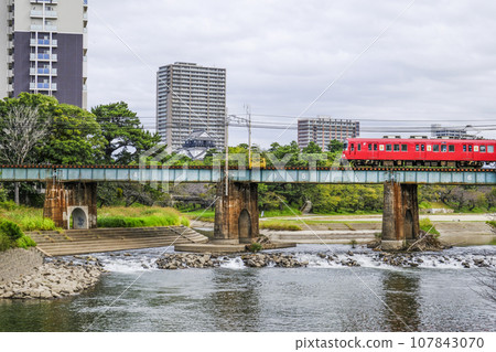 Running train and Okazaki Castle (Aichi Prefecture) Running train and Okazaki Castle (Aichi Prefecture) 107843070