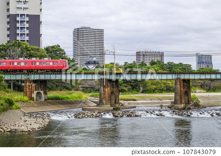 Running train and Okazaki Castle (Aichi Prefecture) Running train and Okazaki Castle (Aichi Prefecture) 107843079