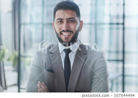 Portrait of successful young businessman in office Portrait of successful young businessman in office 107844494