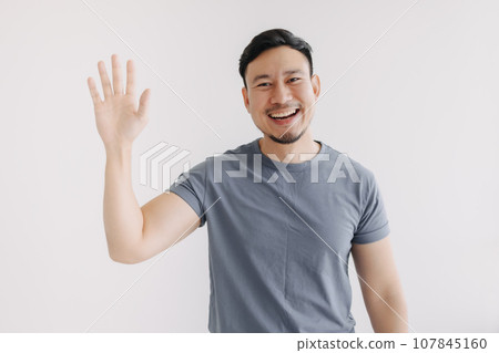 Happy asian man pop out for greeting and say hi, stand isolated on white Happy asian man pop out for greeting and say hi, stand isolated on white 107845160