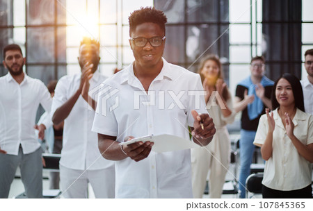 Close up view of business seminar listeners clapping hands 107845365