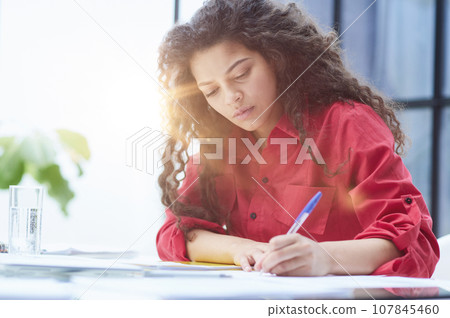 Smiling phone operator in headphones with microphone Smiling phone operator in headphones with microphone 107845460