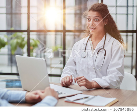 Doctor consulting patient hands closeup. Patient sitting at doctor office. Diagnostic healthcare, medical service, consultation or education, healthy lifestyle concept 107845896