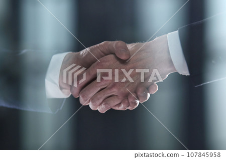 Close-up image of handshake between two colleagues. 107845958