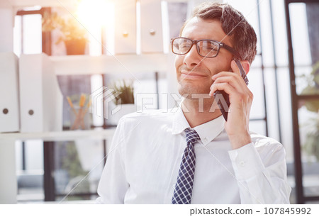 Man accountant or business lawyer talking on smartphone 107845992