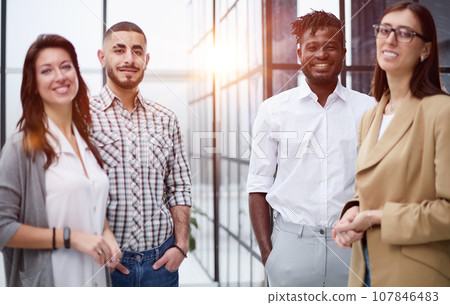 Successful team of young perspective businesspeople in office 107846483