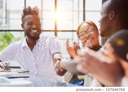 african business people handshake at modern office african business people handshake at modern office 107846768