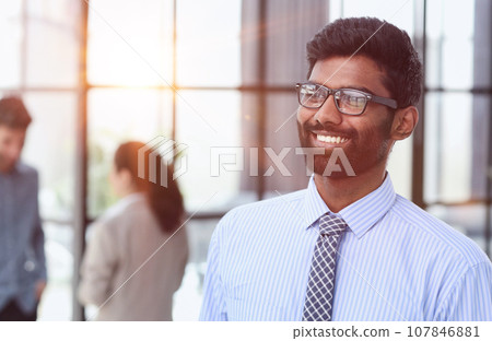 Excited businessman in glasses shouting yes with pleasure and re 107846881