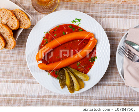 Appetizing Vienna sausages with goulash sauce on served table Appetizing Vienna sausages with goulash sauce on served table 107847503