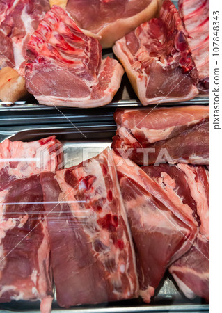 Meat showcase with fresh pork 107848343