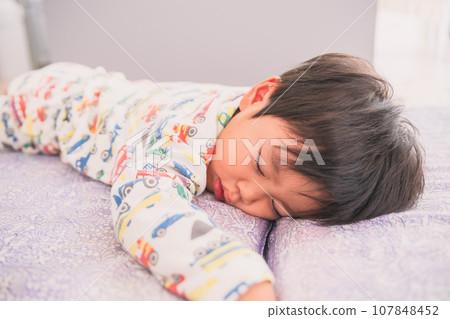 Infant taking a nap Infant taking a nap 107848452