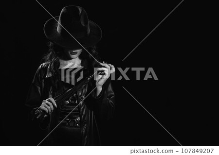 Sexy female dominant mistress with a whip for BDSM sex with submission and domination Sexy female dominant mistress with a whip for BDSM sex with submission and domination 107849207