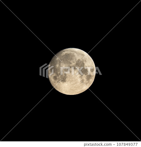 Detailed image of the full moon isolated on black. 107849377