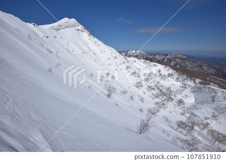 View of the summit and eastern slope from the south ridge of Mt. Koshi Asahidake View of the summit and eastern slope from the south ridge of Mt. Koshi Asahidake 107851910