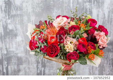 Small Beautiful bouquet of mixed flowers in vase. Floral shop concept . Beautiful fresh cut bouquet. Flowers delivery Small Beautiful bouquet of mixed flowers in vase. Floral shop concept . Beautiful fresh cut bouquet. Flowers delivery 107852952