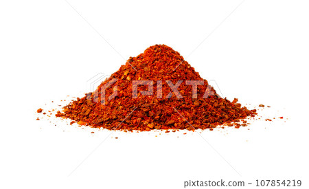 Heap of chilli pepper flakes isolated on white background Heap of chilli pepper flakes isolated on white background 107854219
