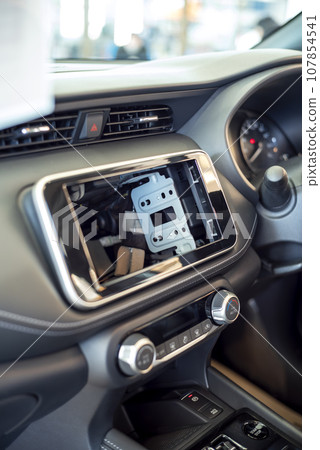 Image of inside the car with the car navigation system removed 107854541
