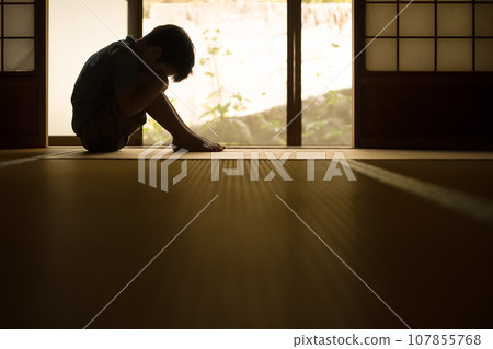 child doing physical education sitting 107855768