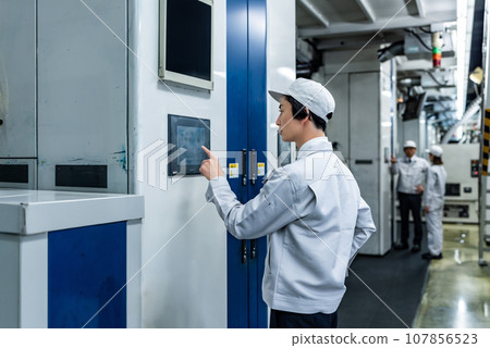 People working in the factory People working in the factory 107856523