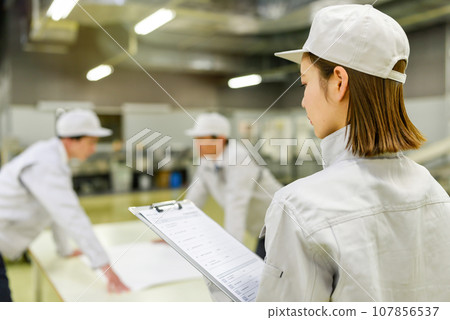 People working in the factory People working in the factory 107856537