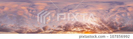 Sunset sky panorama with bright glowing pink Cumulus clouds. HDR 360 seamless spherical panorama. Full zenith or sky dome for 3D visualization, sky replacement for aerial drone panoramas. 107856992