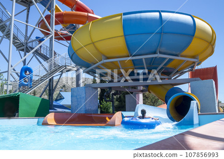 Playground with a swimming pool. water Park for children. colorful sports facilities autdoor games 107856993