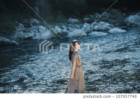 Girls playing on mountain streams 107857748
