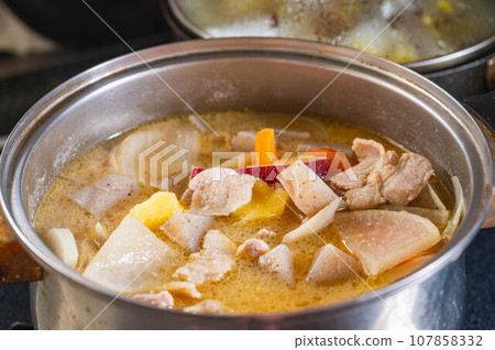 Pork soup simmered in a pot Pork soup simmered in a pot 107858332