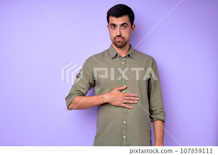 serious handsome bearded man touching belly 107859111