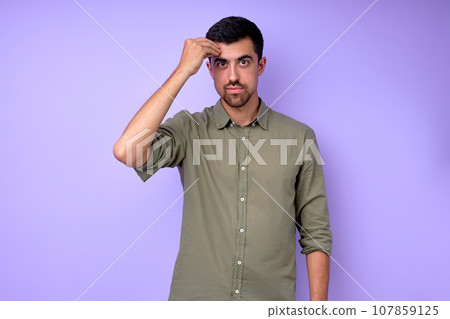 Young serious bearded deaf mute man showing the word clever 107859125
