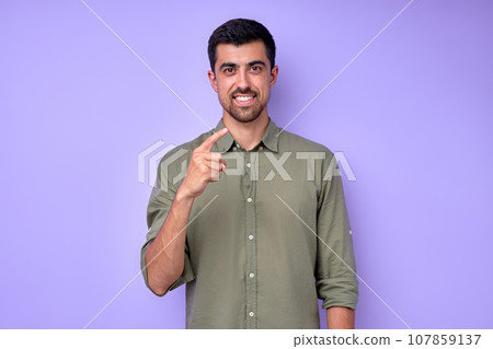 cheerful brunette bearded man demonstrating the letter Z z cheerful brunette bearded man demonstrating the letter Z z 107859137