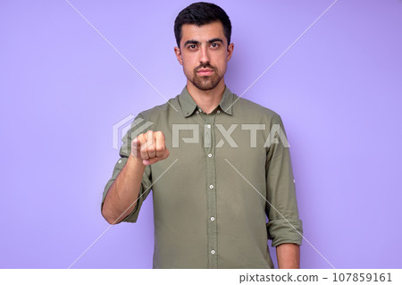 serious handsome man showing letter J j with fingers 107859161