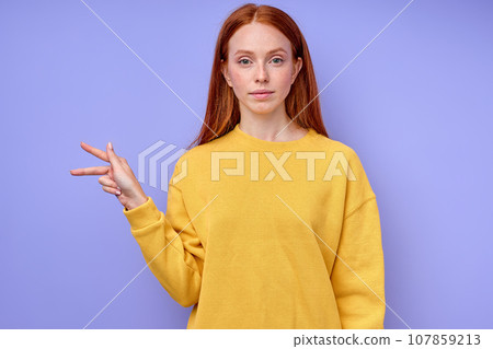 letter K spelling by girl's hand in American Sign Language ASL 107859213