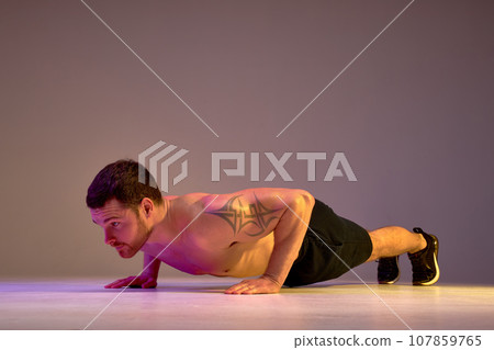 young muscular man taking part in challenge 107859765