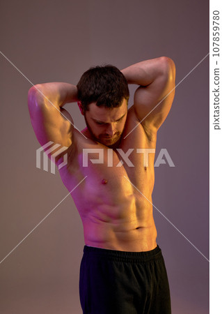 young man boasts with his abs young man boasts with his abs 107859780